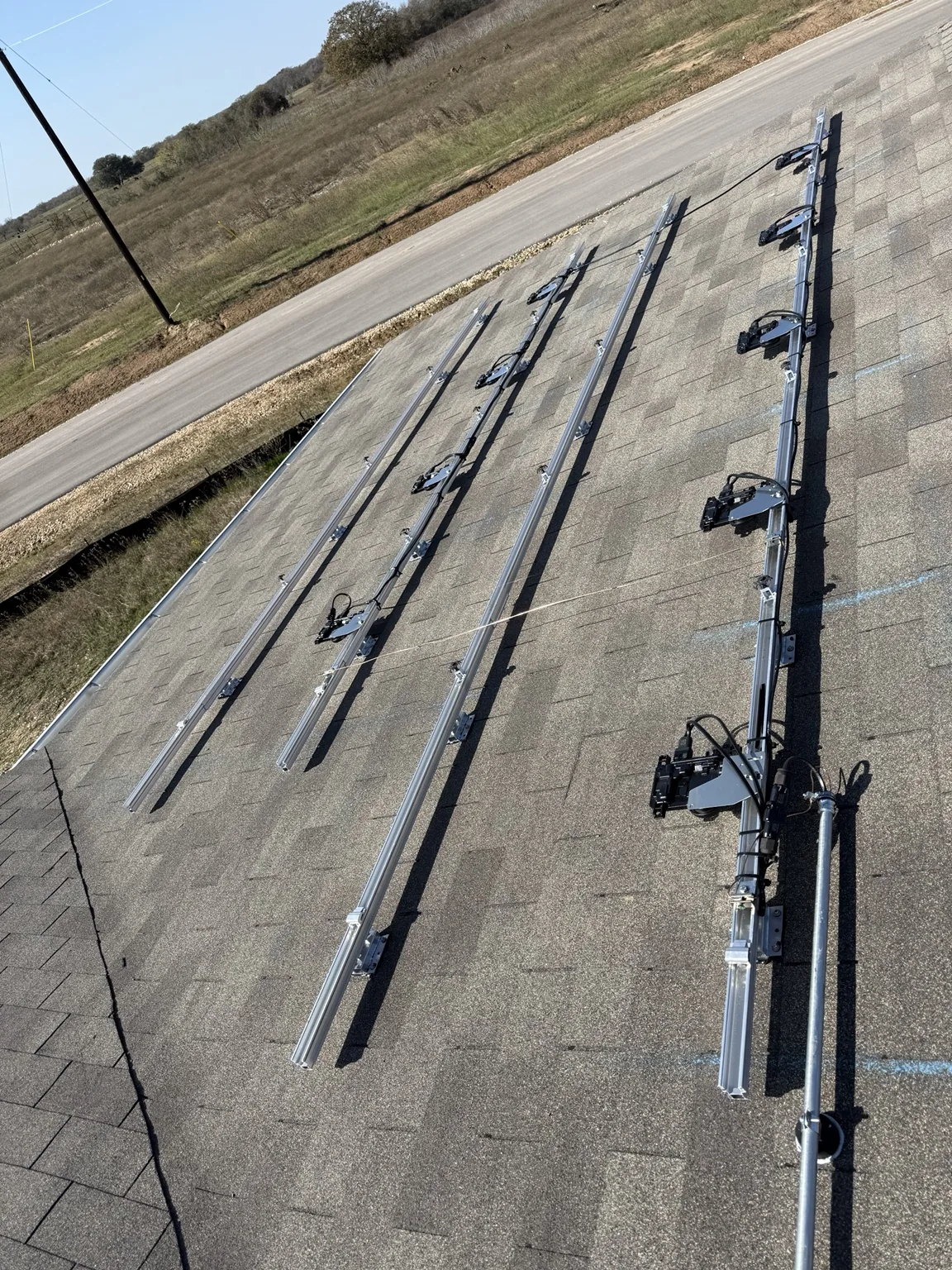 Solar mounting rails and microinverters on a shingle roof