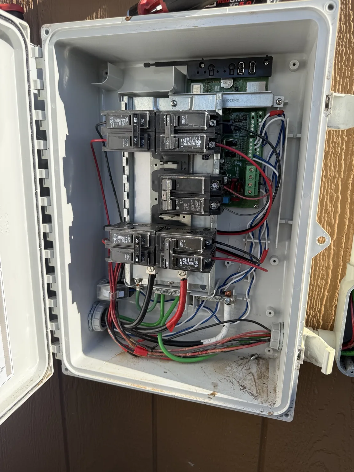 Breakers and monitoring equipment inside a solar combiner enclosure