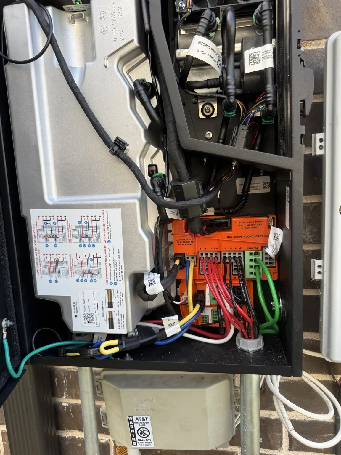 Wiring and connection terminals inside an open solar inverter